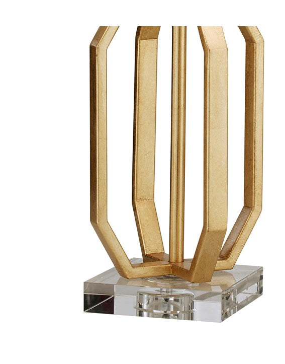 Close up of a cage style metal table lamp base on a square acrylic base plinth.